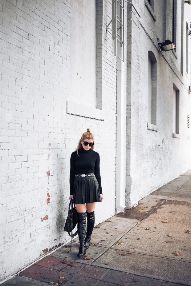turtleneck and pleated leather skirt